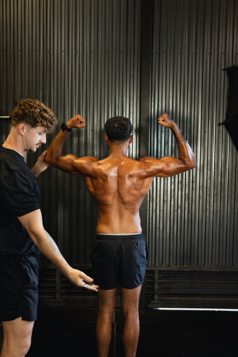 Coach adjusting a client's pose during the photoshoot