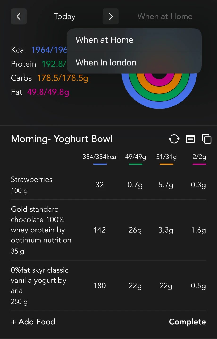 Meal plan in the app with daily calories and macros and a switch between 'When at Home' and 'When in London' plans